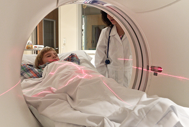 Child in CT scanner.
