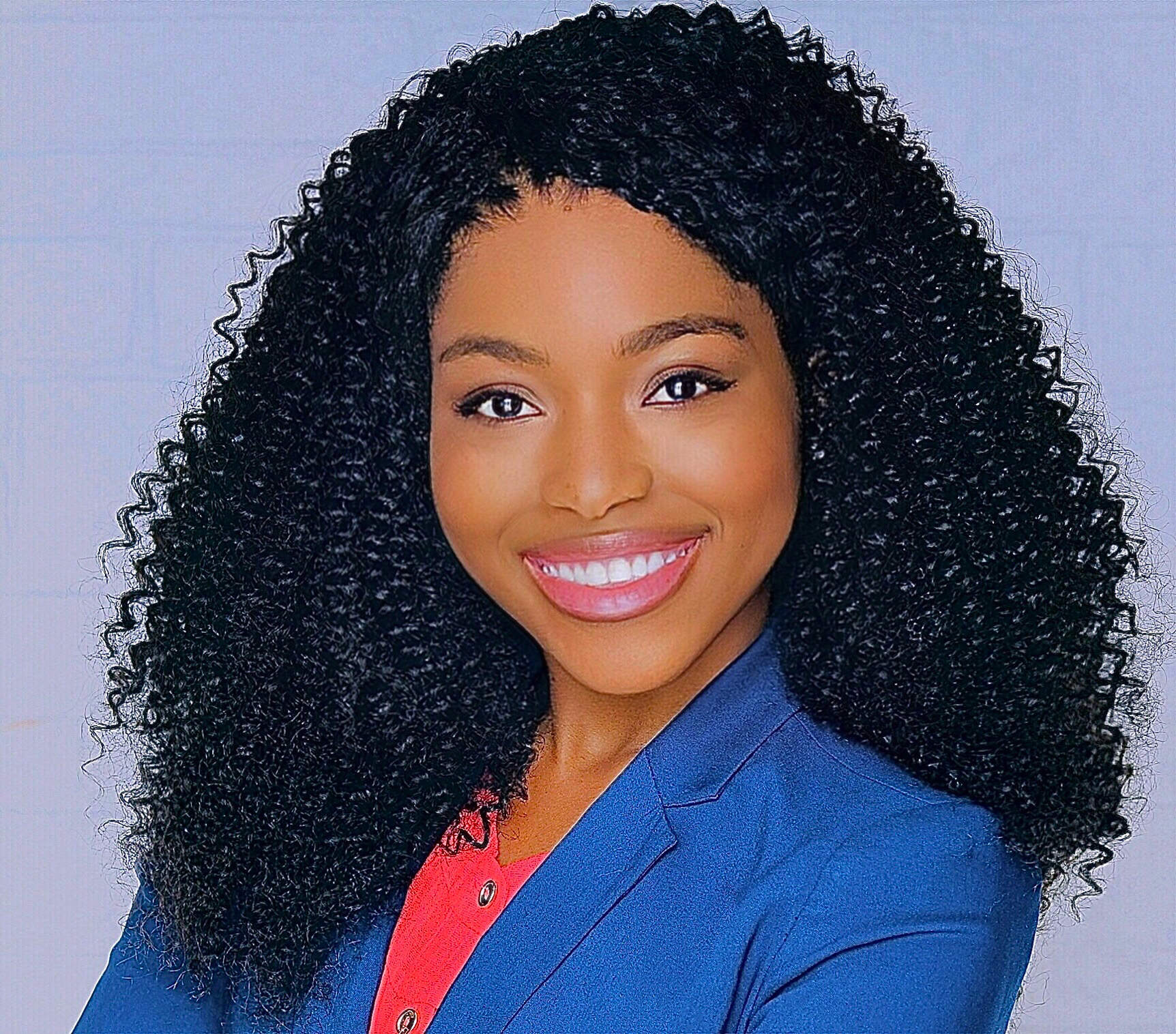 Photo of young woman wearing blue blazer. Dr. Janet Oluwole