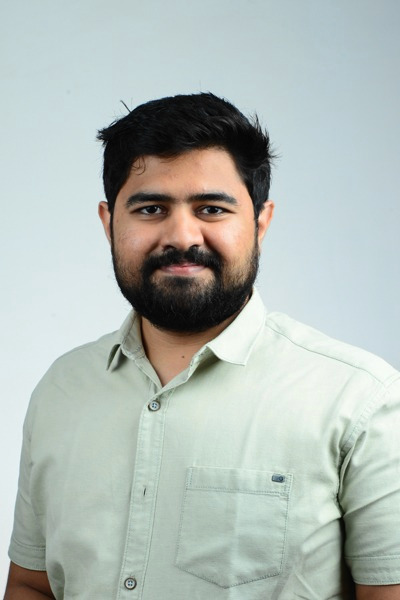 Photo of young man with dark hair and dark facial hair. Dr. Yash Desai.